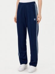 Adidas Spodnie dresowe Beckenbauer JC5793 Granatowy Regular Fit. Niebieskie spodnie dresowe damskie Adidas, bez wzorów, z bawełny. Za 179.99 zł.