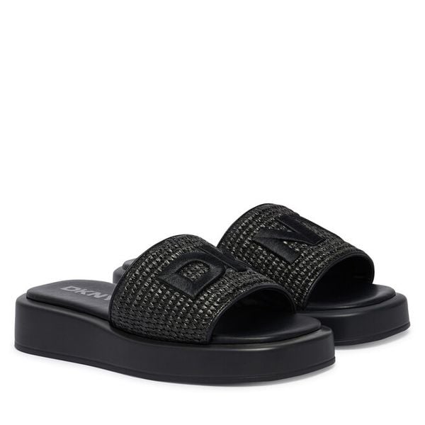 Klapki DKNY. Czarne klapki damskie DKNY, bez wzorów, bez obcasa, bez zapięcia. Za 409.99 zł.