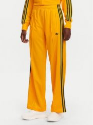 Adidas Spodnie dresowe adicolor Classic Firebird JP2316 Żółty Loose Fit. Żółte spodnie dresowe damskie Adidas, bez wzorów, z dresówki. Za 199.99 zł.