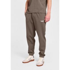 Spodnie do biegania Hummel Legacy 2.0. Niebieskie spodnie materiałowe męskie Hummel, bez wzorów, z dresówki. Za 269.50 zł.