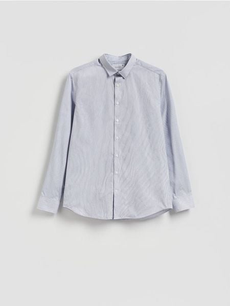 Wzorzysta koszula slim fit - niebieski. Niebieskie koszule męskie Reserved, l, bez wzorów, z bawełny, bez kołnierzyka, bez ramiączek. W wyprzedaży za 55.99 zł.