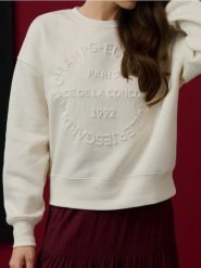 Bluza crewneck oversize z napisem - kremowy. Białe bluzy damskie Sinsay, l, bez wzorów, bez ramiączek, bez kaptura. Za 45.99 zł.