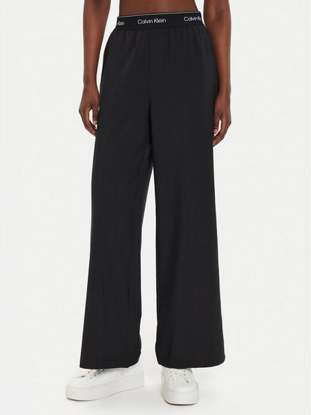 Calvin Klein Performance Spodnie dresowe 00GWF4P606 Czarny Wide Leg. Czarne spodnie dresowe damskie Calvin Klein Performance, bez wzorów, z dresówki. Za 369.99 zł.