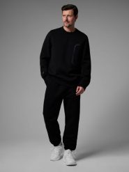 4F Spodnie dresowe joggery męskie 4F x Robert Lewandowski - czarne XL. Czarne spodnie materiałowe męskie 4F, bez wzorów, z dresówki. Za 169.99 zł.