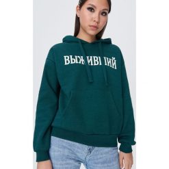 Bluza kangurka z napisem - Turkusowy. Niebieskie bluzy damskie Sinsay, l, bez wzorów, bez ramiączek, bez kaptura. Za 49.99 zł.