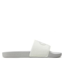 Klapki Calvin Klein Jeans. Klapki damskie Calvin Klein Jeans, bez wzorów, z jeansu, bez obcasa, bez zapięcia. Za 199.99 zł.