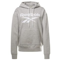 Damska bluza z kapturem Reebok Identity Logo Fleece. Fioletowe bluzy damskie Reebok, na jesień, s, bez wzorów, z bawełny, eleganckie, bez ramiączek, z kapturem. Za 275.15 zł.
