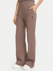 Calvin Klein Jeans Spodnie dresowe Monogram LV047H220G Beżowy ciemny Regular Fit. Brązowe spodnie dresowe damskie Calvin Klein Jeans, bez wzorów, z bawełny. Za 369.99 zł.