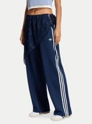Adidas Spodnie dresowe 2In1 Firebird Loose Track Trousers With Lace Skirt LG4273 Niebieski Relaxed Fit. Niebieskie spodnie dresowe damskie Adidas, bez wzorów, z bawełny. Za 369.99 zł.