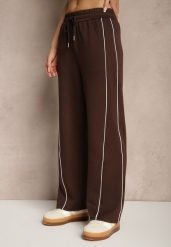 Brązowe Spodnie Dresowe z Bawełną o Szerokim Kroju High Waist z Paskami Salliara. Brązowe spodnie dresowe damskie Renee, bez wzorów, z bawełny, eleganckie, z podwyższonym stanem. Za 69.99 zł.
