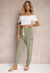 Ciemnozielone Spodnie Cargo High Waist Wykończone Gumką w Pasie Nellindra. Zielone spodnie materiałowe damskie Renee, bez wzorów, z jeansu, eleganckie, z podwyższonym stanem. Za 39.99 zł.