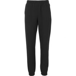Damskie spodnie dresowe Athlecia Ruthie. Czarne spodnie dresowe damskie Athlecia, bez wzorów, z bawełny, klasyczne, z standardowym stanem, do biegania. Za 164.00 zł.