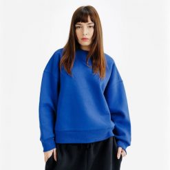 Bluza okrągły dekolt damska Elementals. Niebieskie bluzy damskie Decathlon, m, bez wzorów, z bawełny, bez ramiączek, bez kaptura. Za 149.99 zł.