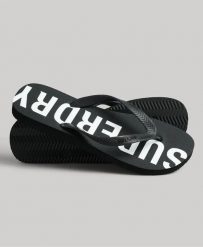 Superdry Code Core Sport Klapki z gumy – Czarny/Biały. Czarne klapki damskie Superdry, bez wzorów, z gumy, sportowe, bez obcasa, bez zapięcia. Za 145.75 zł.