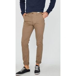Tommy Hilfiger - Spodnie. Eleganckie spodnie męskie Tommy Hilfiger, bez wzorów, z bawełny. W wyprzedaży za 459.90 zł.