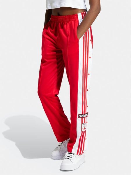 Adidas Spodnie dresowe Adibreak IP0620 Czerwony Regular Fit. Czerwone spodnie dresowe damskie Adidas, bez wzorów, z dresówki. Za 219.99 zł.
