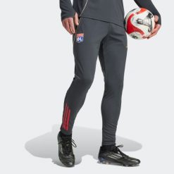 Spodnie piłkarskie treningowe ADIDAS Olympique Lyonnais 25/26. Spodnie dresowe damskie Adidas, bez wzorów, sportowe. Za 299.99 zł.