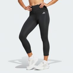 Legginsy Optime Essentials Stash 3/4. Czarne legginsy damskie Adidas, bez wzorów, z materiału. Za 179.00 zł.