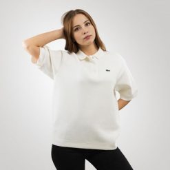 Lacoste Koszulka damska polo Lacoste. Bluzki damskie Lacoste, bez wzorów, bez kołnierzyka, bez ramiączek. Za 689.00 zł.
