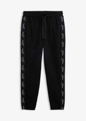 Spodnie joggingowe z czystej bawełny organicznej o kroju loose fit. Czarne spodnie sportowe męskie bonprix, m, bez wzorów, z bawełny. Za 109.99 zł.