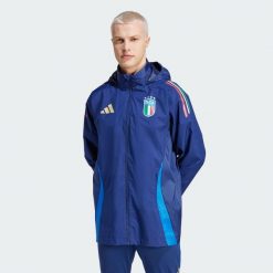 Kurtka Italy Tiro 24 Competition All-Weather. Niebieskie kurtki męskie Adidas, s, bez wzorów, z materiału, sportowe, bez kaptura. W wyprzedaży za 370.55 zł.