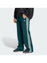 Adidas Spodnie dresowe Firebird KG3701 Zielony Loose Fit. Zielone spodnie sportowe damskie Adidas, bez wzorów, z dresówki. Za 299.99 zł.