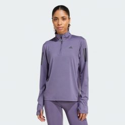 Kurtka Own the Run Half-Zip. Fioletowe kurtki sportowe damskie Adidas, xs, bez wzorów, z materiału, bez ramiączek, bez kaptura, do biegania. W wyprzedaży za 201.05 zł.