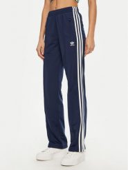 Adidas Spodnie dresowe adicolor Classics Firebird JC8285 Granatowy Regular Fit. Niebieskie spodnie dresowe damskie Adidas, bez wzorów, z dresówki. Za 219.99 zł.