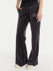 Guess Spodnie dresowe W6RB32 KCUF1 Granatowy Regular Fit. Niebieskie spodnie dresowe damskie Guess, z aplikacjami, z bawełny. Za 389.99 zł.