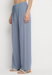 Niebieskie Bawełniane Spodnie z Gumką w Talii o Luźnym Fasonie Efraia. Niebieskie spodnie materiałowe damskie Born2be, bez wzorów, z bawełny, eleganckie. Za 39.99 zł.