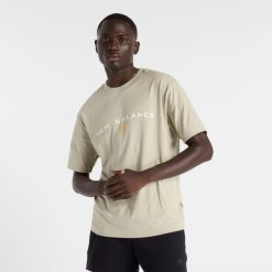 Koszulka męska New Balance MT51506OVN – beżowa. Brązowe koszulki sportowe męskie New Balance, m, bez wzorów, z dresówki, bez ramiączek. Za 89.99 zł.