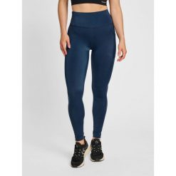 Damskie wysokie legginsy Hummel TE Tola. Niebieskie legginsy damskie Hummel, bez wzorów, z elastanu. Za 268.50 zł.