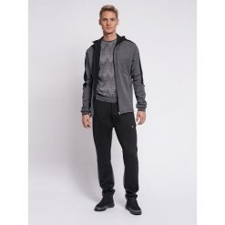 Hummel spodnie sortowe dresowe męskie Tropper Tapered Pants. Czarne spodnie sportowe męskie Hummel, m, bez wzorów, z dresówki, do piłki ręcznej. Za 130.00 zł.