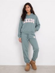 Bluza hoodie oversize z napisem - turkusowy. Niebieskie bluzy damskie Sinsay, l, bez wzorów, sportowe, bez ramiączek, bez kaptura. Za 49.99 zł.