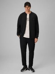 4F Spodnie casual męskie 4F x Robert Lewandowski - czarne L. Czarne spodnie materiałowe męskie 4F, l, bez wzorów, z tkaniny, na fitness i siłownię. Za 229.99 zł.