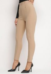 Beżowe Bawełniane Legginsy z Wysokim Stanem i Ozdobnymi Guzikami Rielina. Brązowe legginsy damskie Born2be, bez wzorów, z bawełny. Za 39.99 zł.