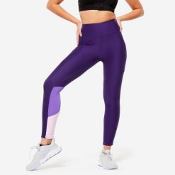 Legginsy fitness damskie Domyos. Fioletowe legginsy damskie DOMYOS, bez wzorów, z elastanu. W wyprzedaży za 59.99 zł.
