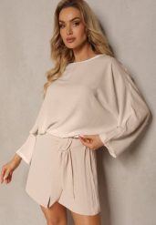 Beżowe Szorty z Gumką w Talii i Lampasami z Falbanką o Asymetrycznym Wykończeniu Laventa. Brązowe szorty damskie Renee, bez wzorów, eleganckie. Za 44.99 zł.