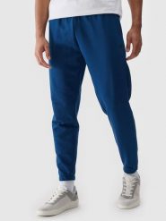 4F Spodnie dresowe joggery męskie - turkusowe M. Niebieskie spodnie materiałowe męskie 4F, l, bez wzorów, z bawełny. Za 149.99 zł.