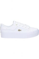 Tenisówki Lacoste Model Ziane Kolor Biały. Białe trampki i tenisówki damskie Lacoste, bez wzorów, ze skóry, bez zapięcia. Za 389.00 zł.