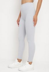 Jasnoniebieskie Legginsy z Wysokim Stanem Parefia. Niebieskie legginsy damskie Born2be, bez wzorów, z jeansu. Za 29.99 zł.