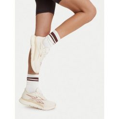 Buty na siłownię Reebok. Białe obuwie sportowe damskie Reebok, bez wzorów, bez zapięcia, na fitness i siłownię. Za 399.99 zł.