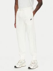 Nike Spodnie dresowe FN3801 Écru Regular Fit. Spodnie sportowe męskie Nike, l, bez wzorów, z bawełny. Za 239.99 zł.