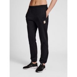 Spodnie damskie do joggingu Hummel sweat. Czarne spodnie dresowe damskie Hummel, bez wzorów, z dresówki, sportowe. Za 201.00 zł.