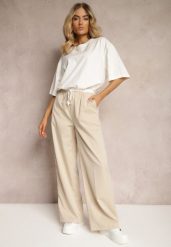 Jasnobeżowe Materiałowe Spodnie z Szerokimi Nogawkami High Waist z Gumką w Talii Comina. Brązowe spodnie materiałowe damskie Renee, bez wzorów, z jeansu, eleganckie, z podwyższonym stanem. Za 119.99 zł.
