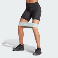 Legginsy Optime 7-Inch. Czarne legginsy damskie Adidas, bez wzorów, z materiału. Za 170.20 zł.