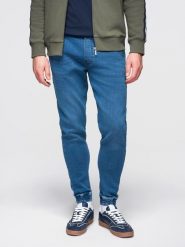 Spodnie męskie jeansowe joggery ze ściagaczem w pasie - niebieskie V1 - Rozmiar: L. Niebieskie spodnie materiałowe męskie Ombre Clothing, z aplikacjami, z bawełny. W wyprzedaży za 167.99 zł.
