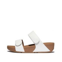 Kobiece skórzane sandały na koturnie z regulacją FitFlop Lulu. Białe sandały damskie FIT FLOP, bez wzorów, z materiału, bez obcasa, na koturnie, bez zapięcia. Za 530.50 zł.