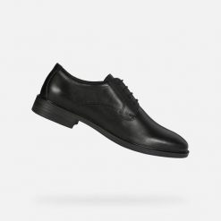 Sandały Geox Gladwin. Czarne sandały męskie Geox, na lato, bez wzorów, z materiału, eleganckie, bez zapięcia. Za 430.50 zł.