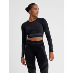 Damska bluzka treningowa bezszwowa z długim rękawem Hummel. Niebieskie bluzki damskie Hummel, bez wzorów, z materiału, sportowe, bez kołnierzyka, bez ramiączek. Za 181.50 zł.